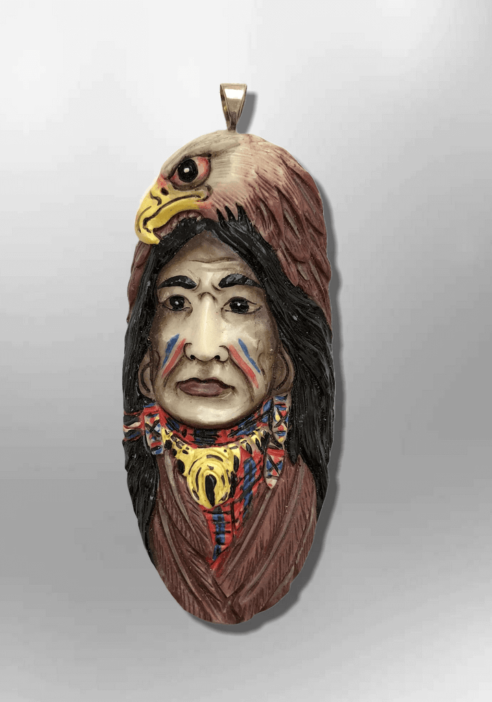 Handmade Bone Carved Painted Indian Head with Eagle Head Feather Long Oval Shape Curved Back Detailed Pendant - Kachina City